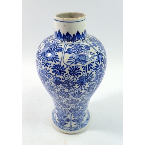 166 - A Chinese 18th century blue and white baluster vase and cover with all over floral decoration, 28cm