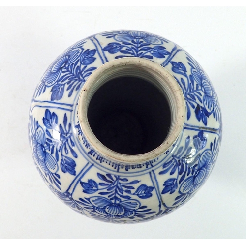 166 - A Chinese 18th century blue and white baluster vase and cover with all over floral decoration, 28cm