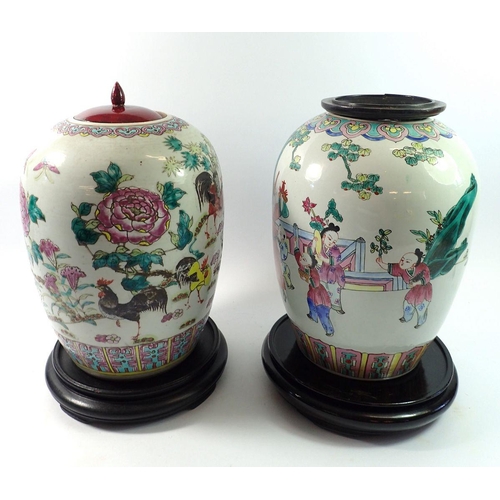 168 - Two early 20th century Chinese famille verte shouldered vases on stand with wooden lids, 28cm tall