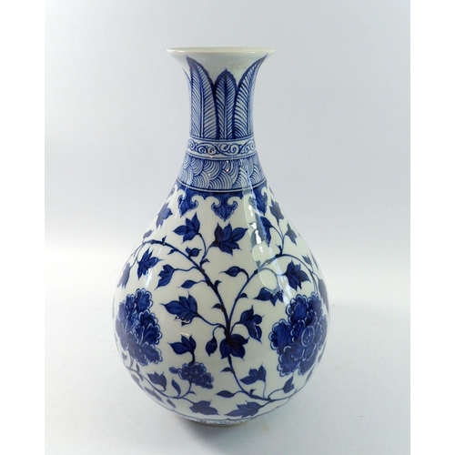 169 - A Chinese blue and white baluster vase decorated peony and trailing leaves, 34cm tall