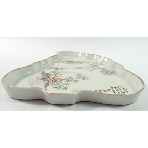 178 - An 18th century Chinese leaf form platter with riverboat scene and inscription, 26.5cm long
