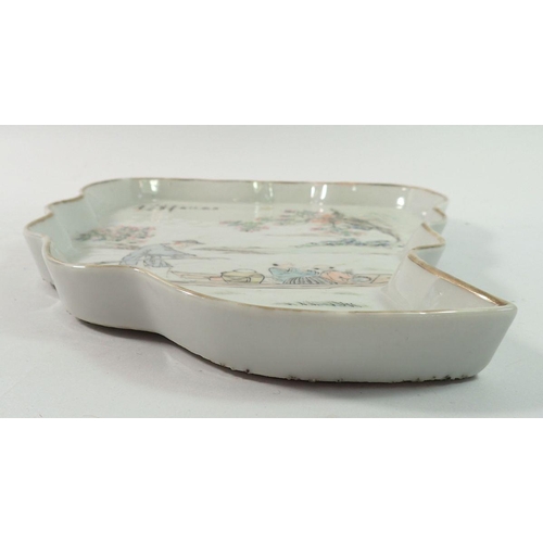 178 - An 18th century Chinese leaf form platter with riverboat scene and inscription, 26.5cm long