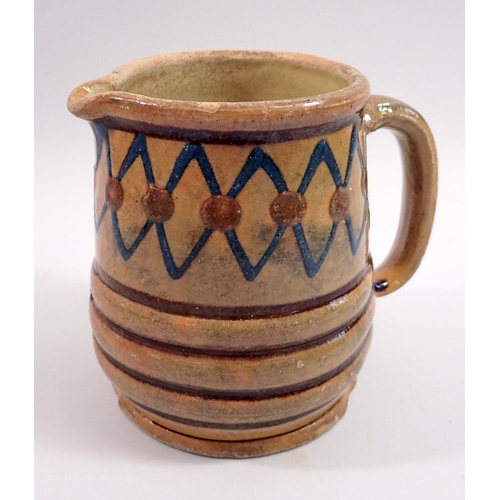 19 - A French earthenware glazed jug with blue and brown decoration impressed 'Depose' and reverse R and ... 