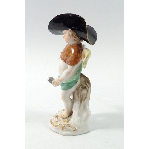 202 - A Meissen 19th century figure of a cherub in large hat, 10cm tall - a/f