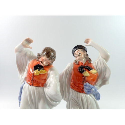 210 - Two Herend porcelain figures of dancing men numbered 5496 and 5490, 30cm tall