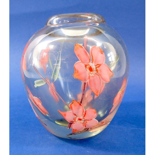 216 - A heavy glass vase with encapsulated floral decoration, 13cm tall