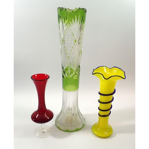 228 - A late 19th century green flashed and cut glass vase - 40cm, a red vase and a yellow glass vase with... 