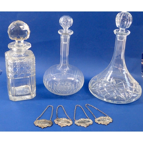 233 - Three cut glass decanters with four silver plated decanter labels