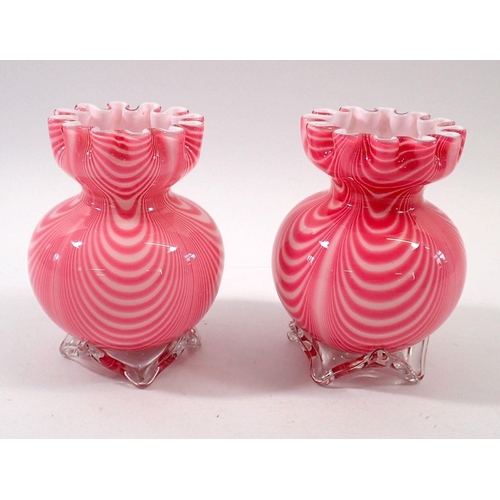 234 - A pair of pink swirled glass vases, 12cm