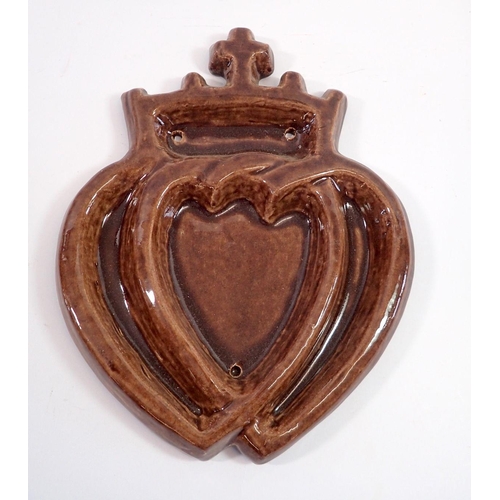 24 - A 19th century unusual pottery heart form plaque, 29cm tall