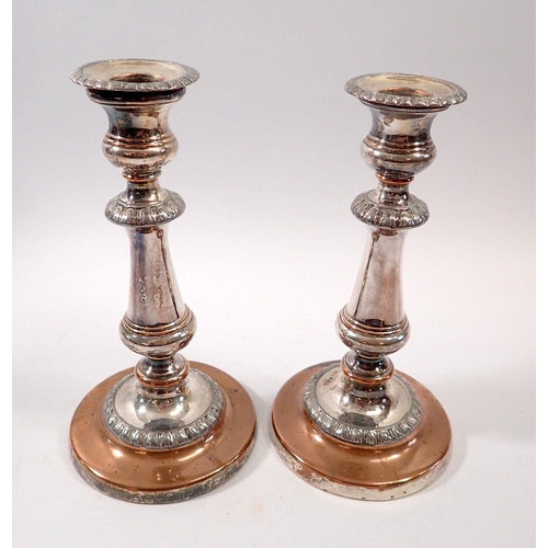 261 - A pair of silver plated candlesticks, 20cm