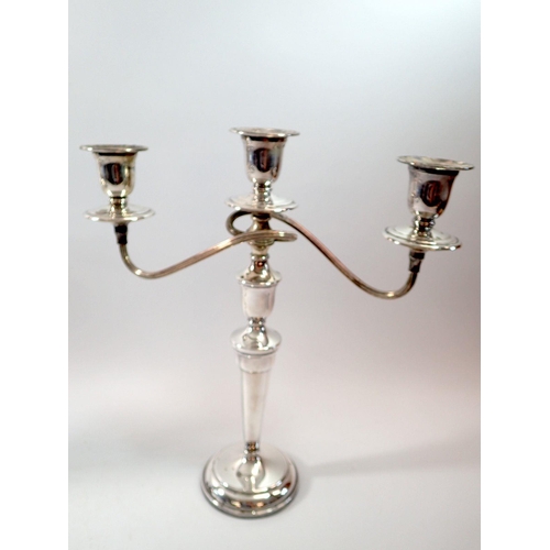 262 - Two silver plated three branch candleabras, 36cm tall