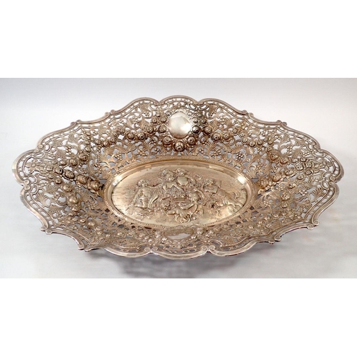 264 - A Victorian large electroplate oval serving dish with ornate embossed cherubs and swag of roses, 52 ... 