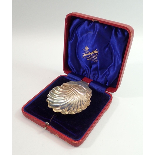 285 - A silver shell form butter dish in Barraclough & Sons box, engraved 'Hughes Jnr', 32g Sheffield 1900... 