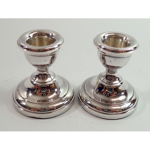 287 - A pair of small silver candlesticks, 6.5cm tall, Birmingham 1962