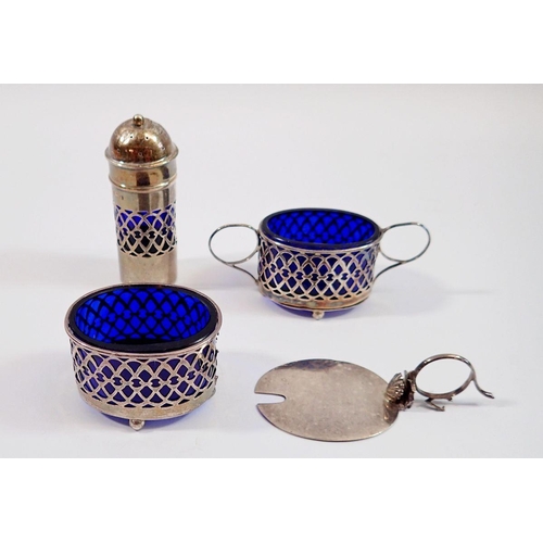 295 - A silver three piece cruet set with blue glass liners, Birmingham 1908 and 1910, one a/f