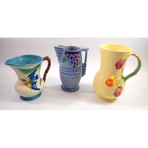33 - A Crown Devon Art Deco jug decorated tulips, 23cm, a Samford jug decorated kingfisher and a Burleigh... 