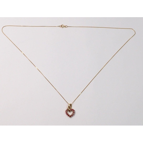 447 - A 9 carat gold and ruby heart pendant on fine 9 carat gold chain, 2g total weight