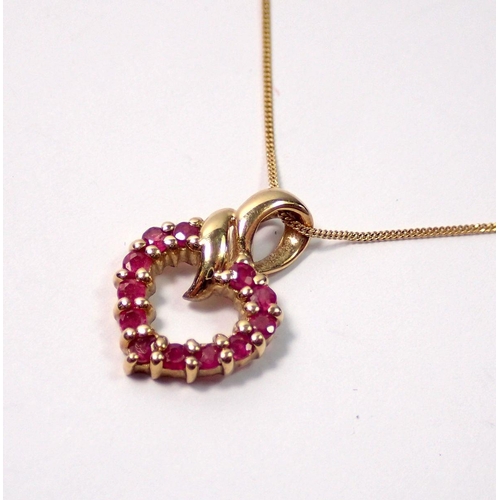 447 - A 9 carat gold and ruby heart pendant on fine 9 carat gold chain, 2g total weight