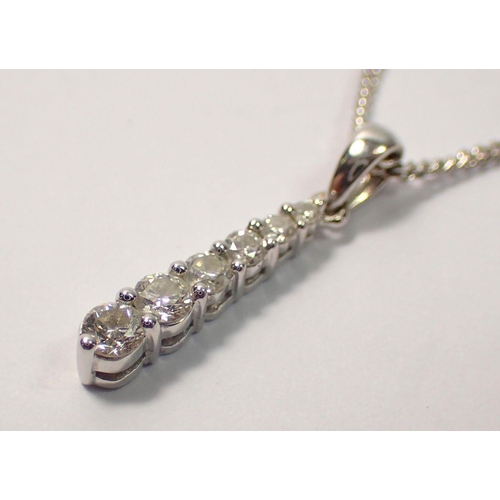 453 - An 18 carat white gold necklace with graduated diamond set pendant, 1.7cm drop, 3.6g