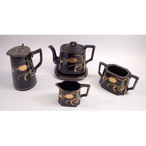 48 - A Victorian black and floral painted tea set comprising teapot, milk sugar and jug