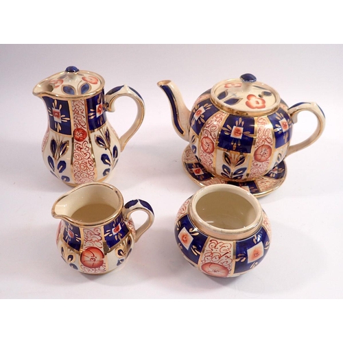 52 - A Sudlows Burslem lustre five piece teaset including teapot, stand, hot water jug, milk jug and suga... 