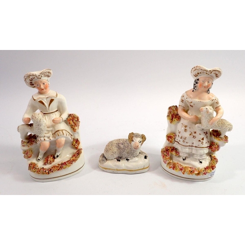 57 - A Victorian Staffordshire pair of figures seated man and woman with lamb and dog, 16cm tall plus a S... 