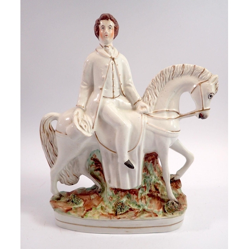 60 - A Victorian Staffordshire group man on horse, 26cm tall