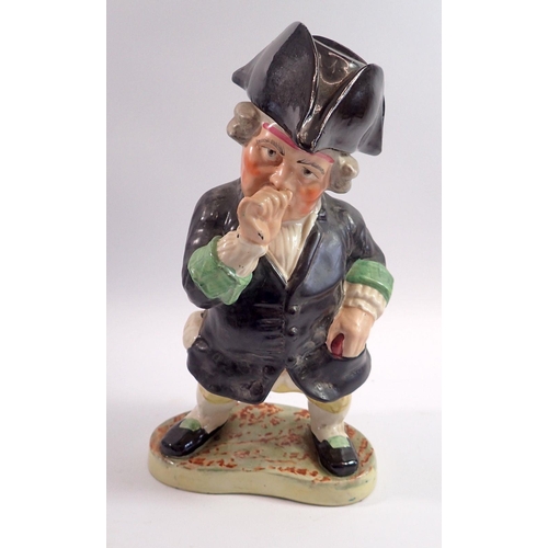 61 - A large Victorian Staffordshire Toby figure in the form of a man taking snuff with tricorn hat lid, ... 