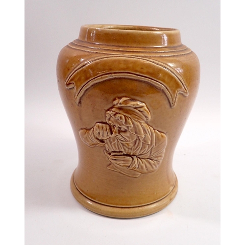 64 - A 19th century stoneware tavern snuff jar moulded woman taking snuff, 21cm