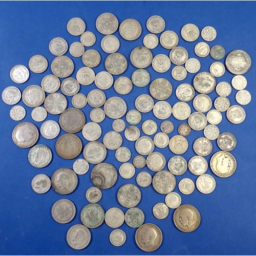 702 - A quantity of pre 1947 British silver coins including threepence, sixpence, florins, half crowns, to... 