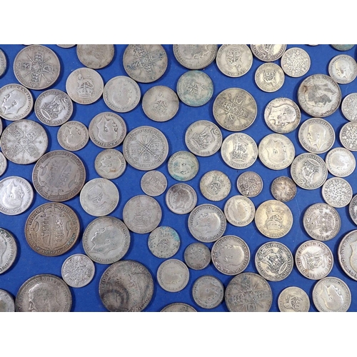 702 - A quantity of pre 1947 British silver coins including threepence, sixpence, florins, half crowns, to... 