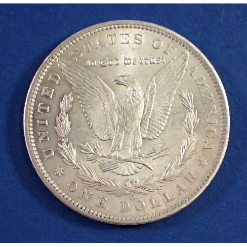 731 - An 1885 USA silver one dollar