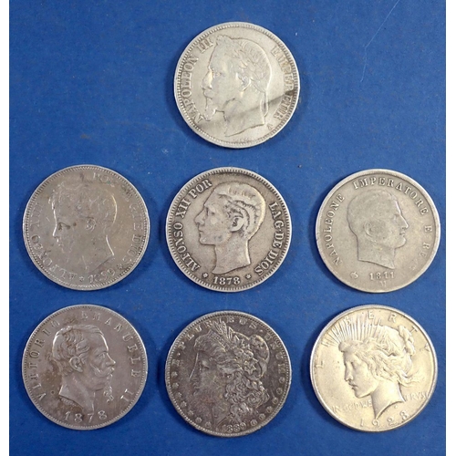 749 - An interesting mix of seven world silver coins including USA dollars x2 1889 and 1923, Napoleon III ... 