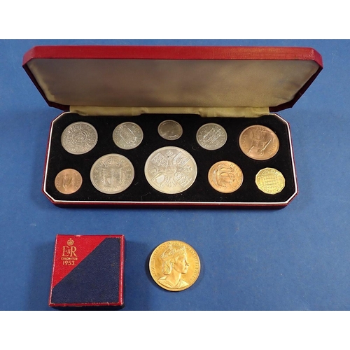 764 - An Elizabeth II Coronation 1953 proof coin set in maroon case plus a cased coronation medal