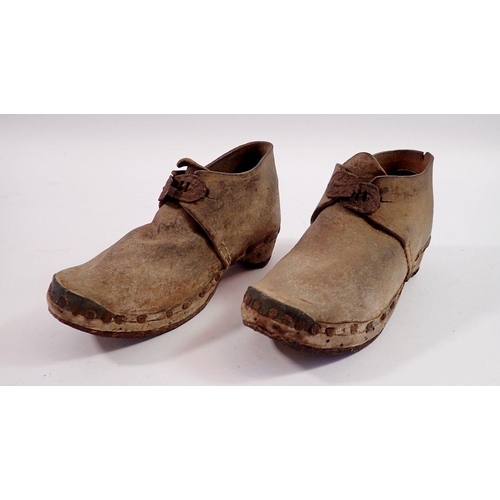 1161 - A pair of Georgian children's leather and metal boots