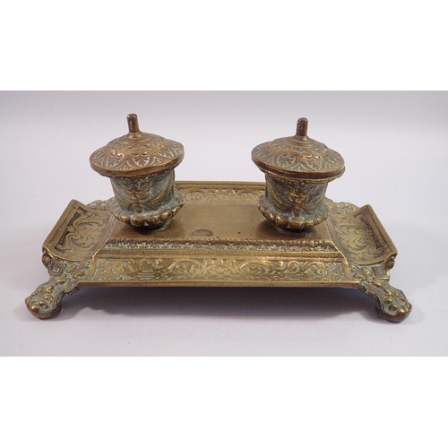 1165 - A cast brass inkstand with strapwork decoration, 24cm wide