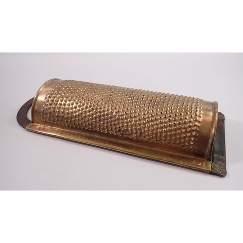 1167 - A Victorian large brass and iron fruit pith grater, 35cm