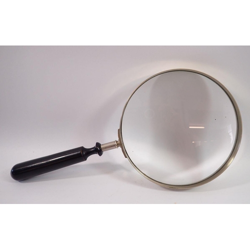 1168 - A large sized magnify glass with ebonized handle, 35cm total length