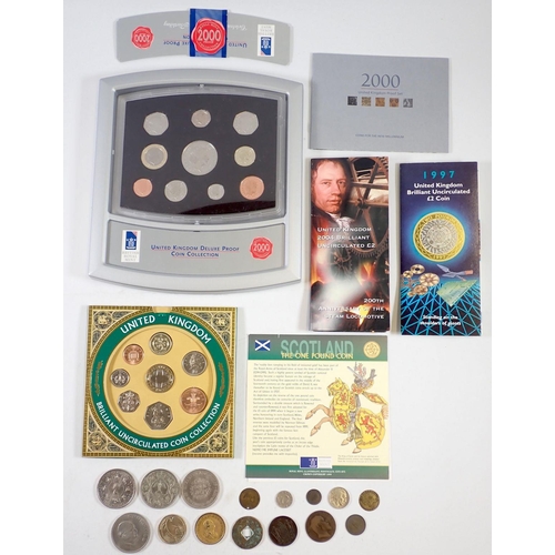 673 - A 2000 Royal Mint United Kingdom deluxe proof coin collection boxed with inserts, 1999 BU coin set, ... 