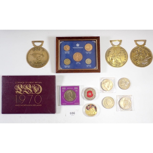 686 - A miscellaneous coin group including framed coins of King George VI and framed pre-decimal coinage o... 