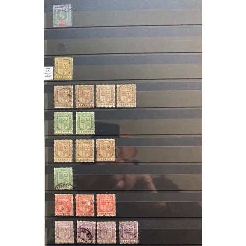 810 - Mauritius stamps: QV-QEII definitives, commemoratives and postage due, mint and used, in blue stock-... 