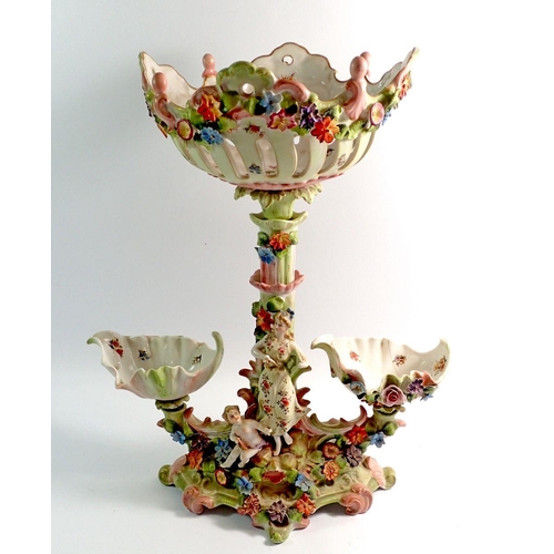 1 - A 19th century continental porcelain centre piece group with three baskets and figure of a woman and... 