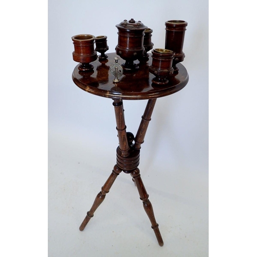 1010 - A Victorian mahogany finish smokers stand on turned supports