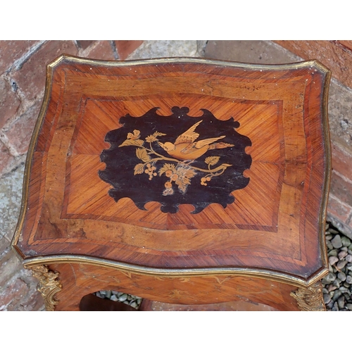 1011 - A late 19th century French small kingwood marquetry occasional table with rise top and bird decorati... 