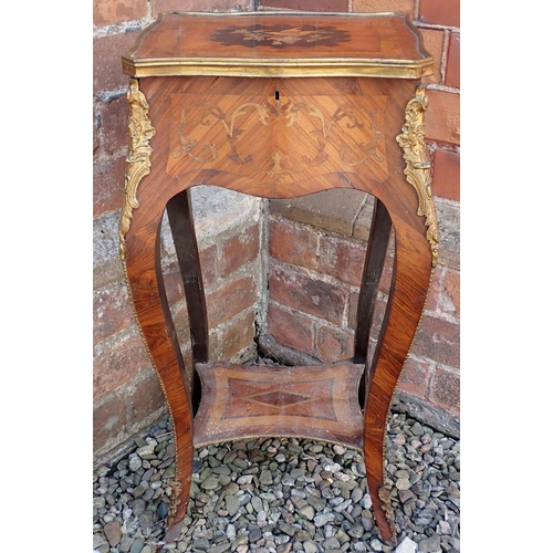 1011 - A late 19th century French small kingwood marquetry occasional table with rise top and bird decorati... 