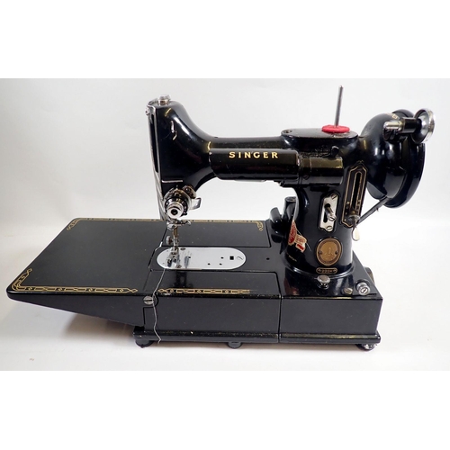 1013 - A Singer sewing machine 222K Featherweight with accessories, instructions, mat and case