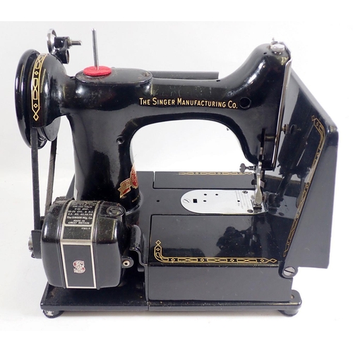 1013 - A Singer sewing machine 222K Featherweight with accessories, instructions, mat and case