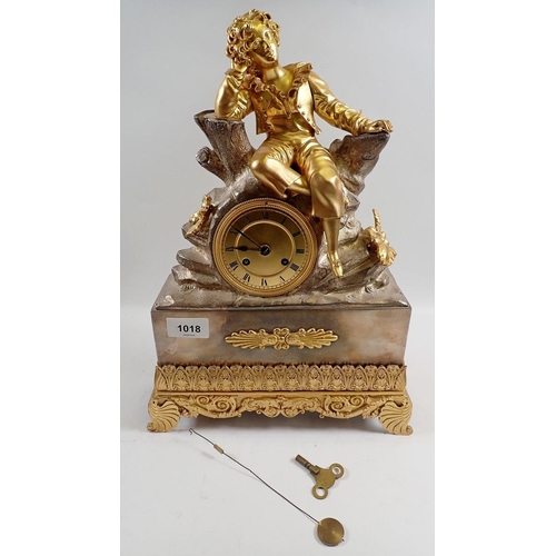 1018 - A fine 19th century French mantel clock with ormolu seated boy on silvered rocky base, with key and ... 