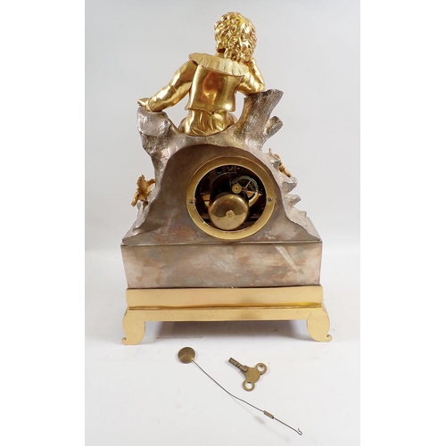 1018 - A fine 19th century French mantel clock with ormolu seated boy on silvered rocky base, with key and ... 